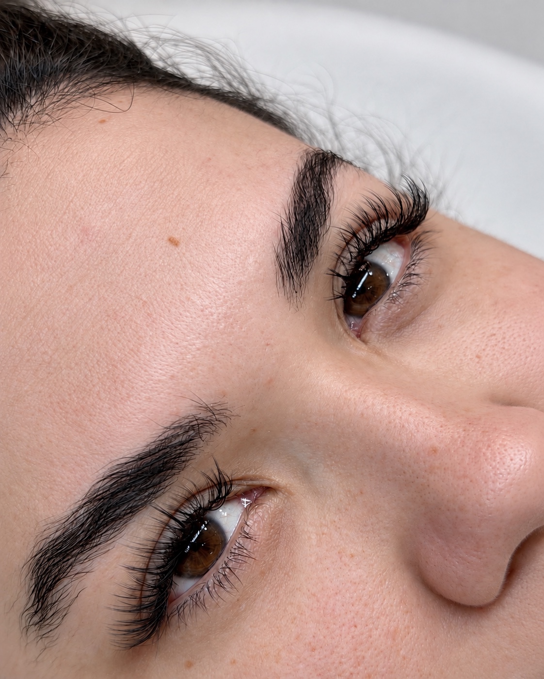 Detailed view of lash extensions and brows