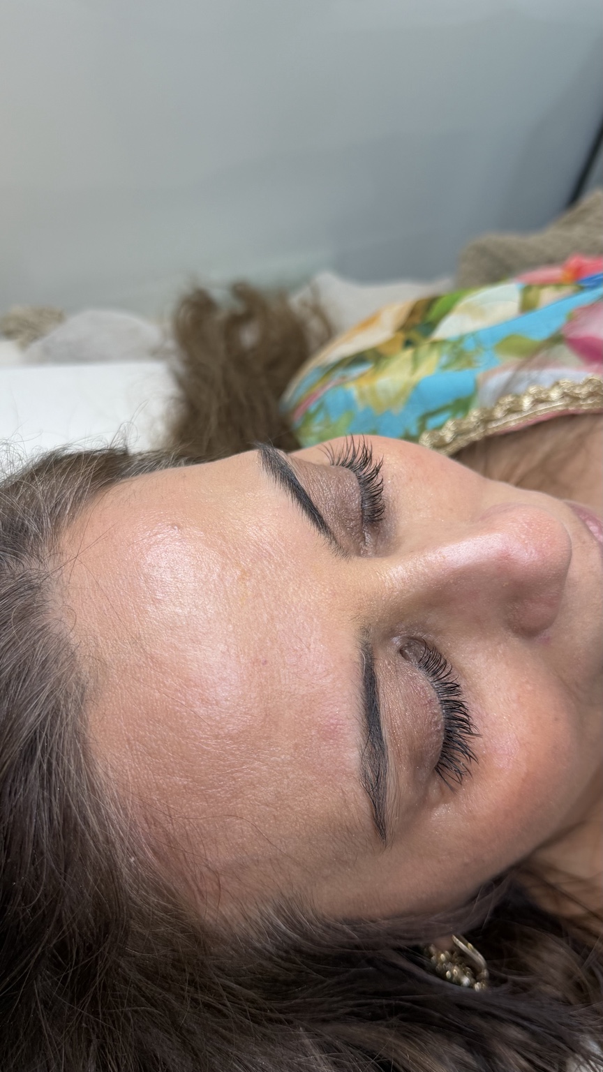 Close-up of a client's lashes and shaped brows